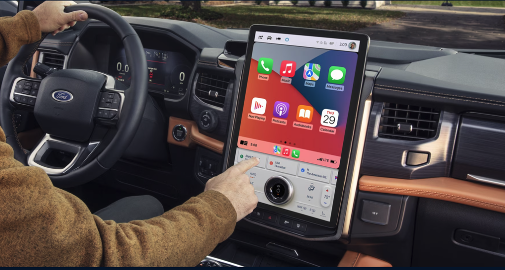 Driver Interacting with the Ford Expedition's Infotainment System Front Interior Dashboard
